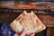 Food of the Caucasian Georgian kitchen,, a girl holds pieces in hands. Piece of pita bread in hand