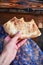 Food of the Caucasian Georgian kitchen,, a girl holds pieces in hands. Piece of pita bread in hand