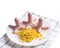 Food for children. Three funny octopus made of sausages on a plate with corn.