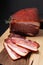 Food concept Artisan Fresh smoked Bacon on wood cutting board with copy space