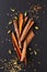 Food concept assortment Oriental spices cardamom pods, coriander seeds, fennel and Cinnamon Cassia Bark Sticks on black slate