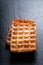 Food concept Classic square Waffles with icing sugat toping on b