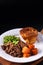 Food concept homemade Beer-Braised Shredded Beef with yorkshire pudding on black background with copy space