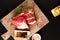 Food concept piece boneless Pork collar on cutting board with spice on black background with copy space