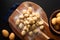 Food concept Spot focus homemade gnocchi on wooden board on black background with copy space