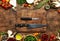 Food cooking background, ingredients for preparation vegan dishes, vegetables, roots, spices, mushrooms and herbs. Cutting board,