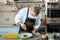 Food cooking, profession and people concept - male chef cook serving plate of polenta and veal tongues with sauce at restaurant ki