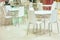 Food court. White tables and chairs. Bright interior