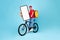 Food Delivery App. Young Courier Guy On Bicycle Showing Big Blank Smartphone