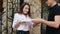 Food Delivery. Courier Giving Woman Box With Pizza Outdoors