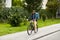 food delivery man with bag riding bicycle