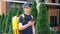 Food delivery man courier walks street watching navigation in smartphone