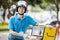 Food delivery man taking food from a bag. Modern life