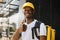 Food delivery, portrait of courier african man with yellow backpack and cap.