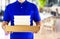 Food delivery service or order food online. Delivery man in blue