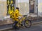 A food deliveryman with a bicycle is walking