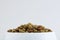 Food for a dog or cat. Dry food for kittens or puppies close-up in a white bowl on a white background. Concept - advertising of