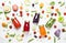Food and drink background. Colorful vegan vegetable juices and smoothies set in bottles on white background, top view