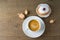 Food and drink concept. Coffee cup with traditional donuts sufganiyah for Hanukkah on wooden table