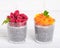 Food and drink, healthy eating and dieting concept. Homemade white chia pudding Two glasses, peach or apricot and raspberry