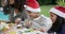 Food, family and christmas with people around a table eating at a party or celebration event. Children and parents