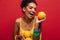 Food fashion photo of joyful mixed-race woman with colorful make