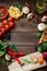 Food frame made of vegetables, pizza, sushi rolls, tomato, pasta, olives and sauce on wooden background. Concept for menu. Flat la