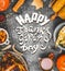 Food frame with various traditional dishes: turkey,pumpkin, corn,sauce and roasted harvest vegetables and text Happy Thanksgiving