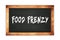 FOOD  FRENZY text written on wooden frame school blackboard