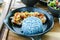 Food healthy, garlic pork with blue rice, blue color made from b