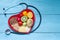 Food on heart plate with stethoscope cardiology concept