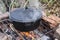 Food on a hike in a cauldron green soup