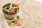 Food Insects: Bamboo worm Bamboo Caterpillar insect fried snack for eating as food items on plate with chopsticks on sackcloth,