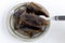 Food Insects: Giant Water Bug for eating as food. Insect items cooking deep-fried snack on plate with fork on white background, it