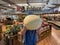 Food Lion Grocery store interior person holding a cantaloupe