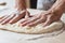 Food pastry prepare baker man hands flatten dough