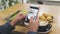 Food photo on phone screen. Closeup male hands with smartphone