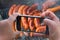 Food photography of baked sausages, meat. Photo of baked meat, shish kebabs with smartphone. Hands taking photo grilled fresh meat