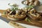 Food photography of a crostini toasted bread with sautÃ©ed mushrooms on mushroom patÃ©