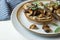 Food photography of a crostini toasted bread with sautÃ©ed mushrooms on mushroom patÃ©