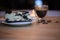 Food photography of homemade chocolate biscuit cheesecake with love heart decorations and blur background cup of coffee