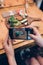 Food photography for social networks. Close-up image of female hands holding phone with food on screen taking picture of