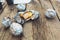 The food at the picnic. Potatoes with lard baked in foil, on a fire. Top view, on a wooden table