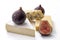Food platter, luxurious taste and deli snack concept with ripe figs and selection of camembert, cheddar and blue cheese isolated