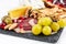 Food Platter With Truffle Cheese, Duck Breast, Brie Cheese, Pecan Nuts, Pomegranate Seeds, Grapes, Almonds, Honey, Olives