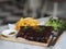 Food pork ribs grilled with BBQ sauce and caramelized in honey with French fries snack on wooden plate