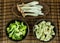 Food preparation on the bowls. The ingredients include fresh green broccoli, Pleurotus Eryngii, and Cauliflower