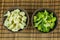 Food preparation on the bowls. The ingredients include fresh green broccolii, and Cauliflower