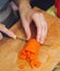 Food preparation. cutting red carrot for vegetarian table