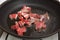 Food preparation - meat pieces in frying pan